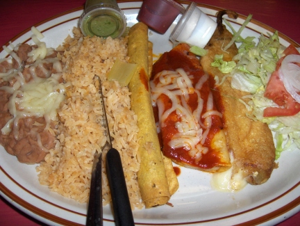 Combination plate with beans, rice, flauta, red enchilada, and chile relleno