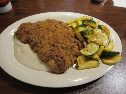 Chicken fried steak with the gravy at the bottom