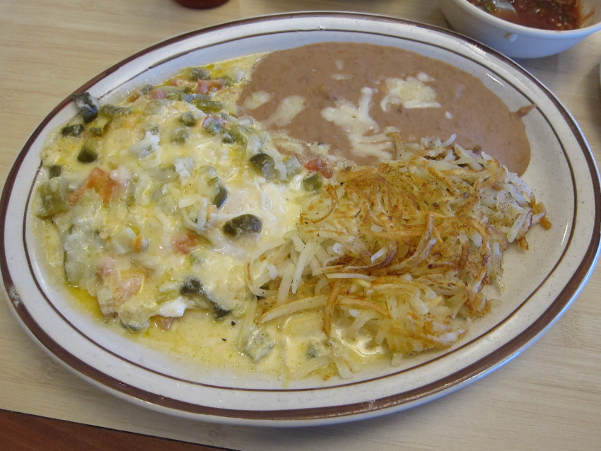 Huevos rancheros with chile con queso