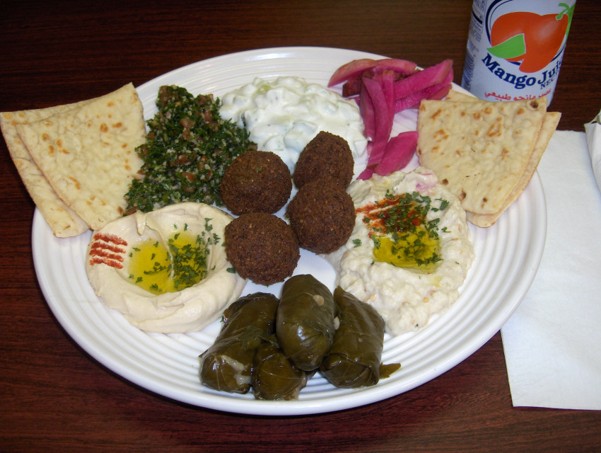Veggie plate with tabbouleh, yogurt salad, baba ghannouj, grape leaves, hummus, and falafel 